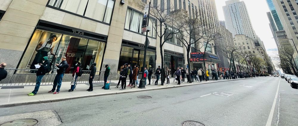 A photo of people lined up outside of rough trade nyc, a record store, during record store day 2023 where certain records are released on this day in limited quantity.