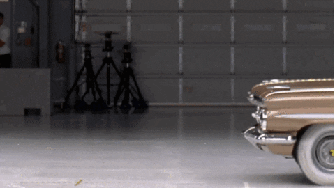 A gif of a crash test between a 2009 Chevy Malibu and a 1959 Bel Air crashing into each other.
